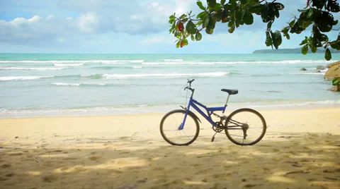 Bicycle parked on a tropical beach Stockbeeldmateriaal 32349232