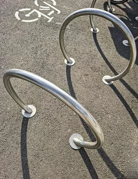 Bicycle parking space featuring modern metal racks design Stock-Fotos