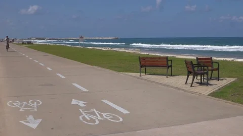 Bicycle passes with sign on the pavement Stock Footage 75932091