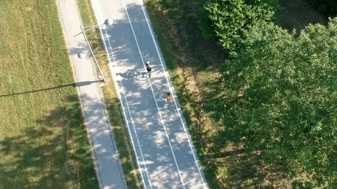 Bicycle passing by another on bicycle trail Stock Footage 89610372