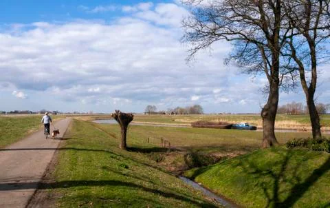 Bicycle path along the river Linde Stock Photos