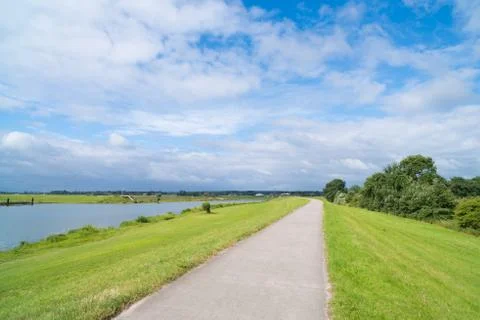 Bicycle path over a dike Stock Photos