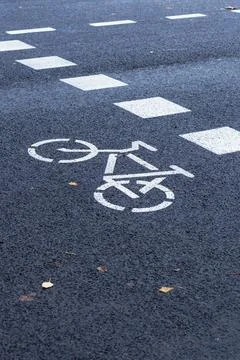 Bicycle path passing through the pedestrian crossing. Stock Photos