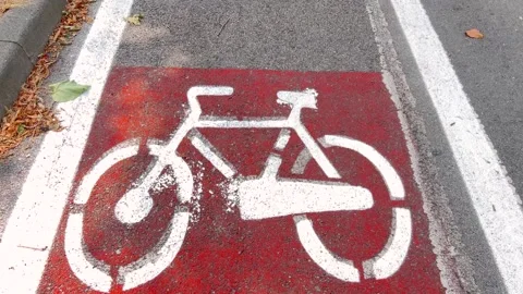 Bicycle path sign on red asphalt Stock Footage 312960534