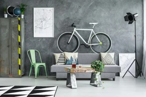 Bicycle placed on couch Stock Photos