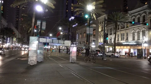 A Bicycle pulling something across Canal Street in New Orleans, Louisiana Stock Footage 88340073