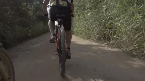Bicycle race. Cyclist practicing mountain biking. High speed Stock Footage 216237685