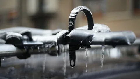 Bicycle rack on a car covered in ice after frozen rain phenomenon Video stock 102129121
