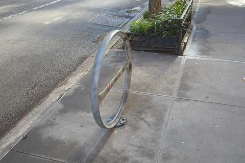 Bicycle rack on pavement Stock Photos