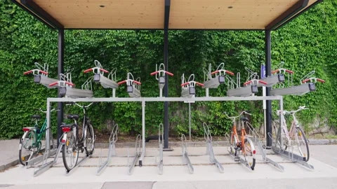 Bicycle rack for storage and parking in the city or next to train station Stock Footage 218464295