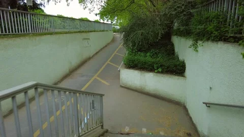 Bicycle ramp and pedestrian path underpass in Zurich park Stock Footage 334629826