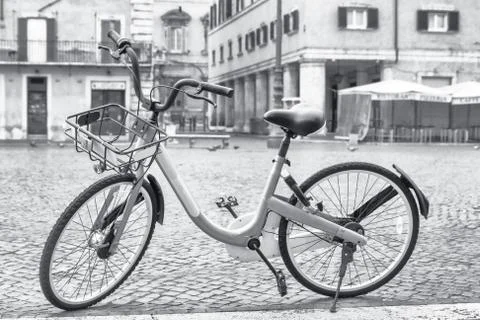 Bicycle ready for sharing on the empty Navona Square in Rome. Italy. Stock Photos