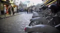 Bicycle rental service, people walking along street and relaxing after work day 4k or 4k+ Resolution