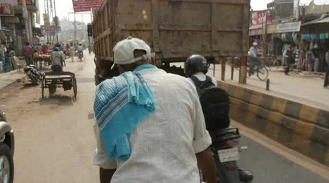 Bicycle Rickshaw Ride in Traffic Stock Footage 10604196