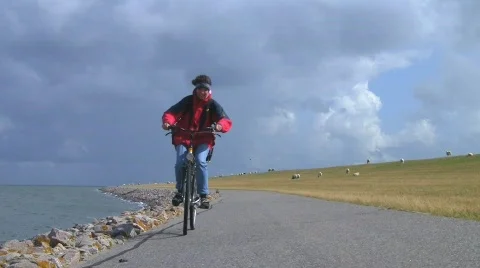 Bicycle ride on dike Stock Footage 503820