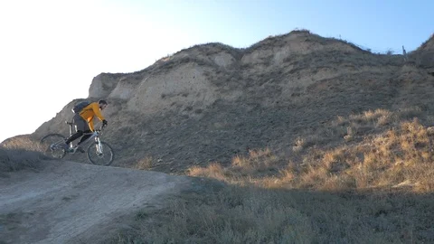 Bicycle rider on the hill Stock Footage 99602185