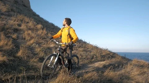 Bicycle rider on the hill Stock Footage 99603318