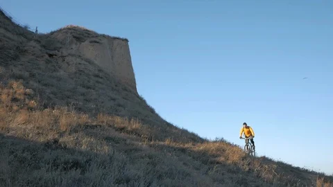 Bicycle rider on the hill Stock Footage 99603409