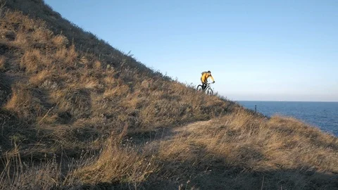 Bicycle rider on the hill Stock Footage 99603583