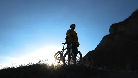 Bicycle rider on the hill Stock Footage 99604074