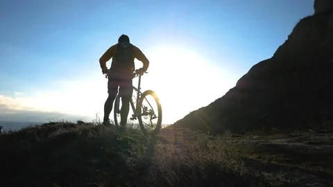 Bicycle rider on the hill Stock Footage 99604126