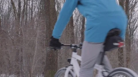 Bicycle rider on snow Stock Footage 85385428