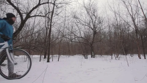 Bicycle rider on snow Stock Footage 85385471