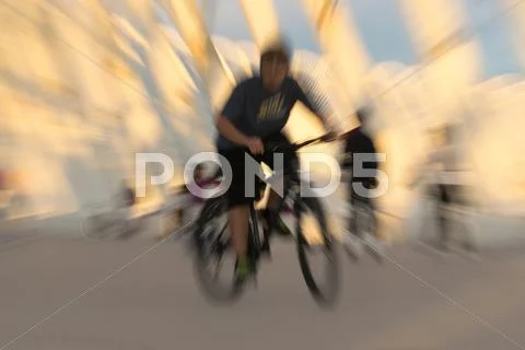Bicycle rider with a zoom burst effect. Stock Photos