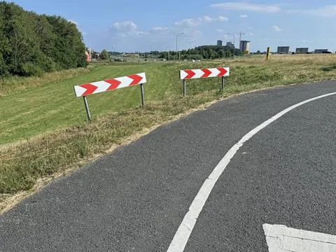 Bicycle road marking for sharp bend Stock Photos