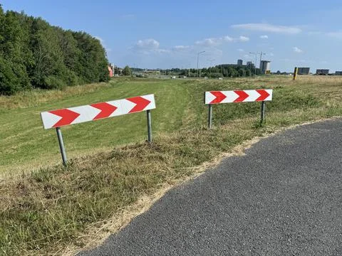 Bicycle road marking for sharp bend Stock Photos