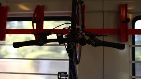 Bicycle securely fastened in train interior showing convenient transport for cyc Video stock 315413798