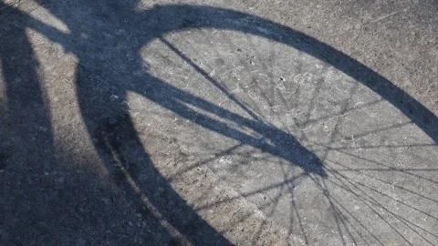 Bicycle Shadow Cast on Concrete Ground Stock Footage 326989499
