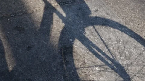 Bicycle Shadow Cast on Concrete Ground Stock Footage 326989504