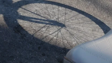 Bicycle Shadow Cast on Concrete Ground Stock-Footage 329227344