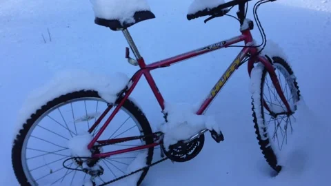 Bicycle standing just after big snowfall Stock Footage 221583359