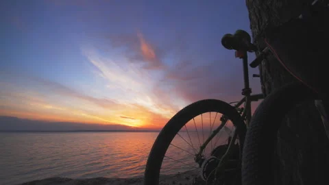 Bicycle standing on a sunset background Stock Footage 92336233