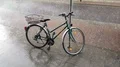 Bicycle at street sign while heavy summer rain in Brunswick city area 4k or 4k+ Resolution