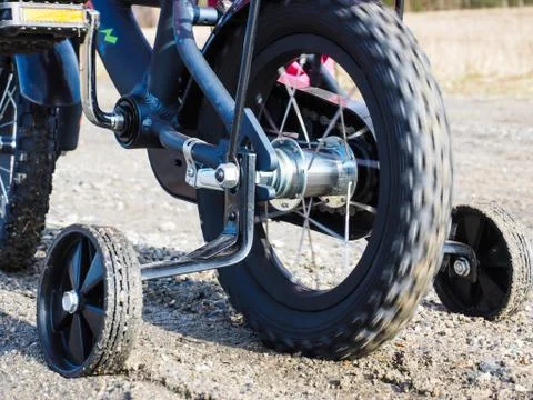 Bicycle with supporting wheels Foto stock