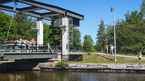 Bicycle tourists on bascule bridge Stock Footage 96153359