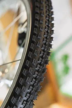 Bicycle wheel close-up. Selective focus on tire. Stock Photos