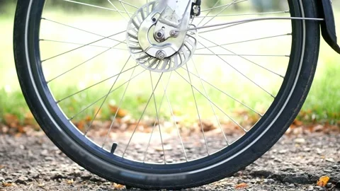 Bicycle wheel rotating close up, riding a bicycle, exercising outdoors, cycling Stock Footage 205562906