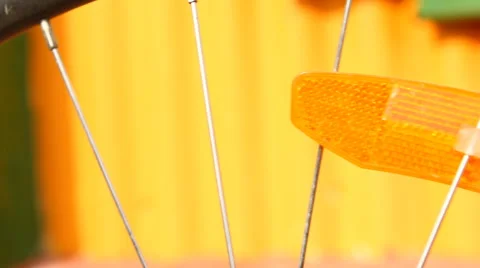 Bicycle wheel with rotating reflectors closeup Stock Footage 49941508