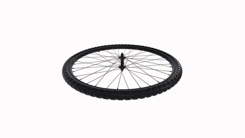 Bicycle wheel spinning on a surface in a bright space Stock Footage 296015710