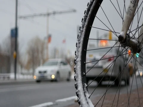 Bicycle Wheel with Traffic in Background Stock Footage 74587234