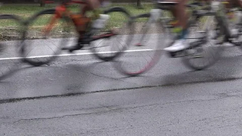 Bicycle wheels during the cycle road race Stock Footage