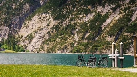 Bicycles on alpine lake. Stock Footage 90360652