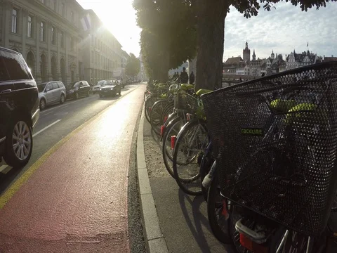 Bicycles and bikes on street in Lucerne Switzerland Stock Footage