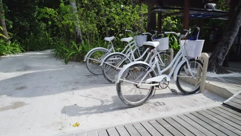 Bicycles are parked in the bicycle parking lot in the Maldives Stock Footage 242920159