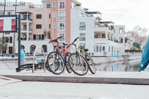 Bicycles are parked on the embankment. Bicycle parking Stock Photos