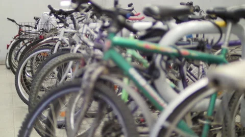 Bicycles are standing in a row. Close-up, rack focus 4K Stock Video Stock Footage 53420267